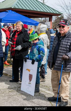 Child in leprechaun hat with hand-drawn sign at No Kings protest, Ludington Michigan, 28 March 2026. Jeffrey Wickett/Alamy Live News